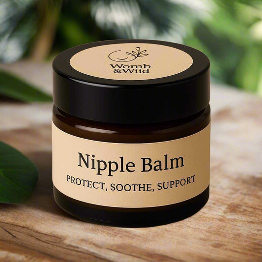 Jar of Womb & Wild Nipple Balm on a beige background