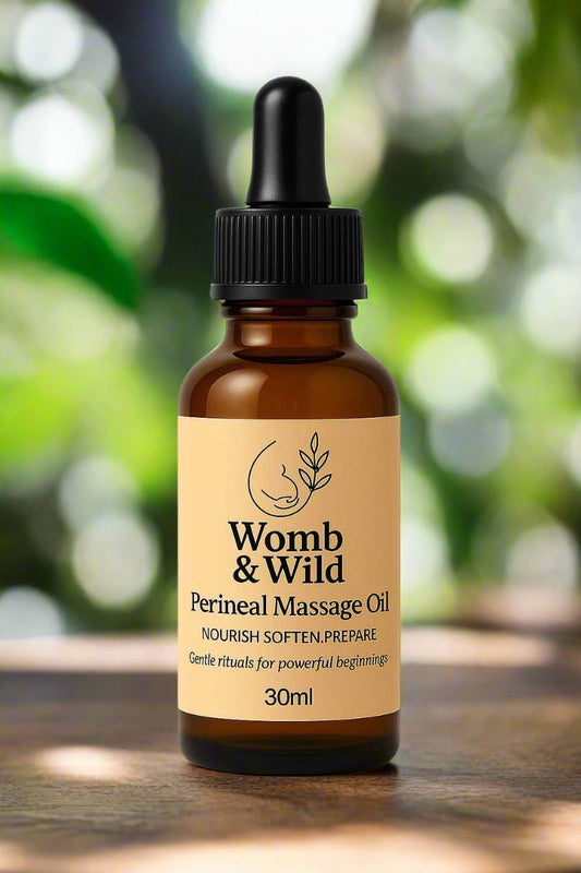 Bottle of Womb & Wild Perineal Massage Oil on a white background
